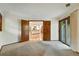 Bedroom showcasing kitchen view, carpet, and balcony door at 2960 Shadow Creek Dr # 201, Boulder, CO 80303