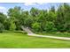 Enjoy a walk through nature on the community bridge surrounded by mature trees and vibrant green spaces at 2960 Shadow Creek Dr # 201, Boulder, CO 80303