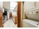 Laundry area with stackable white washer and dryer plus cabinets and sink at 2960 Shadow Creek Dr # 201, Boulder, CO 80303