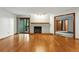 Bright living room featuring hardwood floors, a fireplace, and sliding glass doors to the outside at 2960 Shadow Creek Dr # 201, Boulder, CO 80303