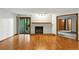 Living room with a fireplace, sliding glass door, and wood floors at 2960 Shadow Creek Dr # 201, Boulder, CO 80303