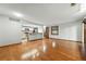 Open-concept living space with hardwood flooring and view of the kitchen at 2960 Shadow Creek Dr # 201, Boulder, CO 80303