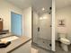 Stylish bathroom featuring a modern vanity, a frameless glass shower, and contemporary fixtures, enhancing its spa-like ambiance at 960 Quitman St, Denver, CO 80204