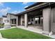 Inviting covered patio with a fireplace, offering a perfect outdoor entertaining space at 6429 Stable View St, Castle Pines, CO 80108