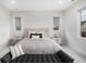 Spacious bedroom featuring plush bedding, stylish furniture, and plenty of natural light at 6429 Stable View St, Castle Pines, CO 80108