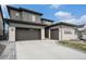 Contemporary two-story home with a three-car garage and modern architectural details at 6429 Stable View St, Castle Pines, CO 80108