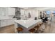 Bright kitchen with large island, modern appliances, and a walk-in pantry at 6429 Stable View St, Castle Pines, CO 80108