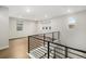 Bright loft area with hardwood floors, recessed lighting, and windows offering natural light and views at 6429 Stable View St, Castle Pines, CO 80108