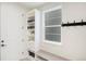 Mud Room features a built-in storage cabinet, bench, and natural light from a window at 6429 Stable View St, Castle Pines, CO 80108