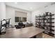 Home office with a large desk, ergonomic chair, and a built-in bookshelf at 6429 Stable View St, Castle Pines, CO 80108