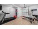 Home workout room with a treadmill, weight bench, and plenty of space for fitness activities at 6429 Stable View St, Castle Pines, CO 80108