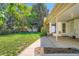 Expansive backyard featuring lush green lawn and mature trees at 8075 Sunset Dr, Lakewood, CO 80214