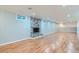 Spacious finished basement with a cozy fireplace, perfect for entertaining and relaxation at 8075 Sunset Dr, Lakewood, CO 80214