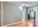 Finished basement featuring durable flooring and access to a well-equipped laundry room and bathroom at 8075 Sunset Dr, Lakewood, CO 80214