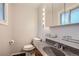Modern bathroom featuring a stylish sink, mirror, and lighting, perfect for daily routines at 8075 Sunset Dr, Lakewood, CO 80214