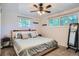 Cozy bedroom with plush carpeting, dual windows, and neutral tones, creating a serene and relaxing space at 8075 Sunset Dr, Lakewood, CO 80214