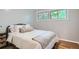 Bright bedroom with hardwood floors and ample natural light, providing a warm and welcoming atmosphere at 8075 Sunset Dr, Lakewood, CO 80214