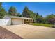 Charming single-story home featuring a spacious driveway and well-maintained lawn at 8075 Sunset Dr, Lakewood, CO 80214