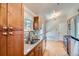 Modern kitchen with stainless steel appliances, granite counters, and wood cabinets at 8075 Sunset Dr, Lakewood, CO 80214