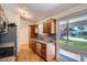 Bright kitchen with stainless steel appliances, modern counters, and wood cabinets at 8075 Sunset Dr, Lakewood, CO 80214