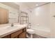 Bathroom featuring a single sink vanity, toilet, and shower-tub combination at 1313 S Clarkson St # 205, Denver, CO 80210