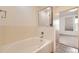 Well-lit bathroom with a large tub and shower stall, accessible from the bedroom at 1313 S Clarkson St # 205, Denver, CO 80210
