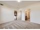 Spacious bedroom with neutral carpet and doorways to ensuite and kitchen at 1313 S Clarkson St # 205, Denver, CO 80210