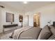Bright bedroom featuring modern furnishings and an ensuite bathroom view at 1313 S Clarkson St # 205, Denver, CO 80210