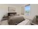 Cozy bedroom with neutral tones, stylish decor, and natural light at 1313 S Clarkson St # 205, Denver, CO 80210