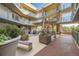 Beautiful courtyard area with seating, pergolas, and landscaped planters at 1313 S Clarkson St # 205, Denver, CO 80210