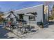 Exterior of gray building with the word 'Steam' displayed, featuring outdoor seating with umbrellas at 1313 S Clarkson St # 205, Denver, CO 80210