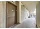 Building hallway showing the exterior of unit 205 and the community patio area at 1313 S Clarkson St # 205, Denver, CO 80210