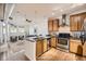 Modern kitchen with stainless steel appliances, granite countertops, and open layout at 1313 S Clarkson St # 205, Denver, CO 80210