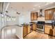 Modern kitchen with stainless steel appliances, granite countertops, and hardwood floors at 1313 S Clarkson St # 205, Denver, CO 80210