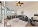 Bright living room featuring hardwood floors, ceiling fan, and modern furnishings at 1313 S Clarkson St # 205, Denver, CO 80210
