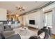 Open-concept living space with hardwood floors, modern furnishings, and bar seating at 1313 S Clarkson St # 205, Denver, CO 80210