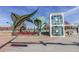Exterior view of light rail station with elevator and leaf-shaped art installation on a sunny day at 1313 S Clarkson St # 205, Denver, CO 80210