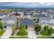 Aerial view of a well-planned neighborhood with single-Gathering homes, green spaces, and community amenities at 722 Eva Peak Dr, Erie, CO 80516