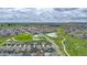 An aerial shot of the neighborhood showcasing the green spaces, walking paths, and community layout at 722 Eva Peak Dr, Erie, CO 80516