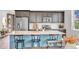 Kitchen with dark cabinets, stainless steel appliances, and breakfast bar with seating at 722 Eva Peak Dr, Erie, CO 80516