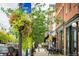 Charming street view with flower baskets and sidewalk cafe seating near museum at 722 Eva Peak Dr, Erie, CO 80516