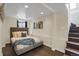 Finished basement bedroom with recessed lighting, stylish decor, and staircase at 4017 King St, Denver, CO 80211