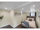 Finished basement bedroom with recessed lighting, stylish decor, and updated flooring at 4017 King St, Denver, CO 80211
