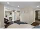 This bedroom features hardwood floors, recessed lighting, modern decor, stairs, and an entrance to a bathroom at 4017 King St, Denver, CO 80211