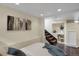 This bedroom features a modern design, recessed lighting, decorative wall art, and stairs leading to another level at 4017 King St, Denver, CO 80211