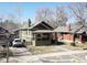 Charming home featuring a covered front porch, driveway, and a well-maintained lawn at 4017 King St, Denver, CO 80211