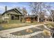 Street view of the home featuring a well maintained lawn, rock details, and inviting facade at 4017 King St, Denver, CO 80211