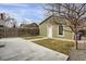 View of backyard with partial grass coverage, partial concrete coverage and a light-green home at 4017 King St, Denver, CO 80211