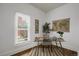Bright office space with large window, glass desk, stylish rug, and world map at 4017 King St, Denver, CO 80211