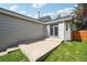 This home features a concrete patio area that has stairs that lead to the grass yard at 68 N Quicksilver Ave, Castle Rock, CO 80104